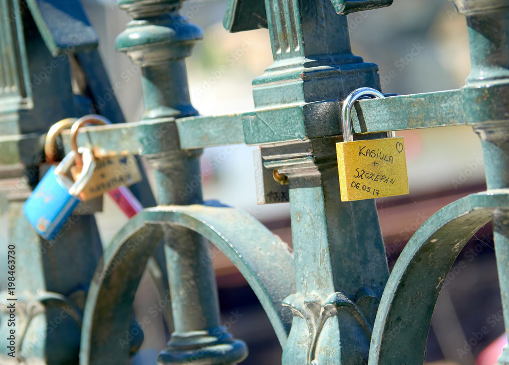 PRAGUE, CZECH REPUBLIC - MAY 17, 2017: Love Padlocks on the railings beside the river Vltava PRAGUE, CZECH REPUBLIC - MAY 17, 2017: Love Padlocks on the railings beside the river Vltava