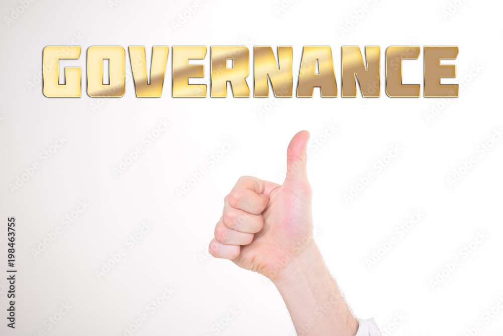 A businessman shows an inscription:GOVERNANCE A businessman shows an inscription:GOVERNANCE