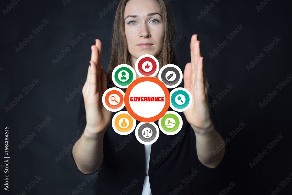 A businessman shows an inscription:GOVERNANCE A businessman shows an inscription:GOVERNANCE