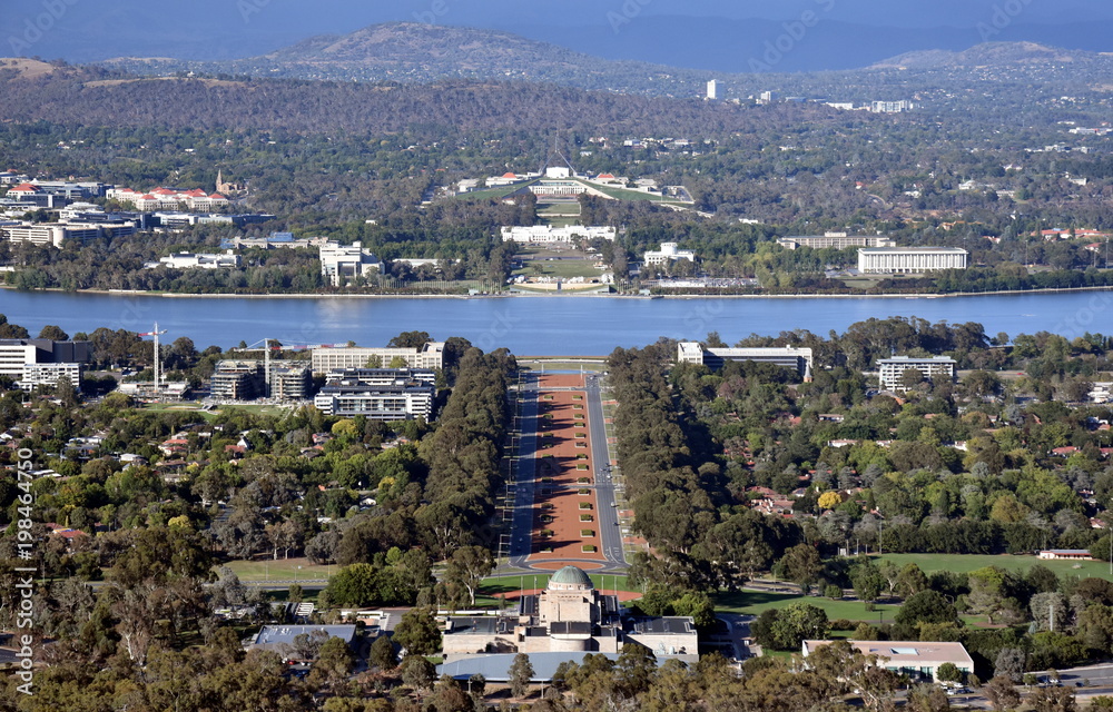 Panoramic view of Canberra, Australia in daytime from Mount Ainslie featuring the Australian War Memorial, Lake Burley Griffin, Molonglo River, Old Parliament House and New Parliament House.
