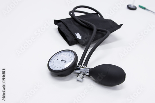 Sphygmomanometer or  blood-pressure cuff on a white background