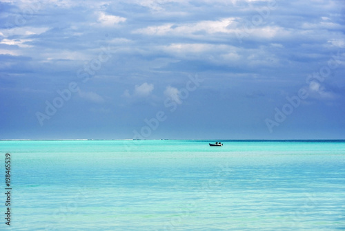 Lonely boat in the Indian ocean, Male, Maldives. Copy space for text. © ggfoto