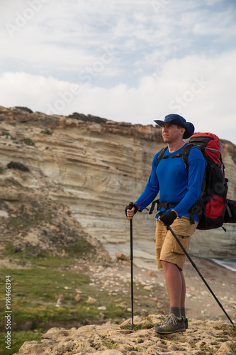 campaign with a backpack on with a tent 