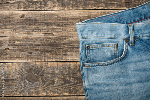 Blue Jeans on wooden background