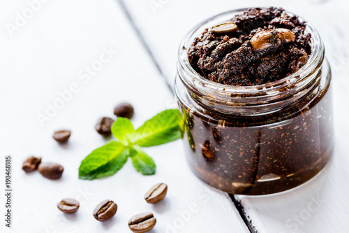 Organic scrub from ground coffee on table background