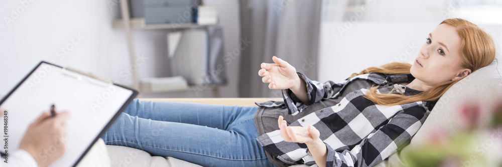 Young girl talking with therapist