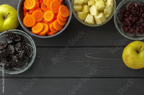 Sliced carrot, apples, dried prunes and cranberry