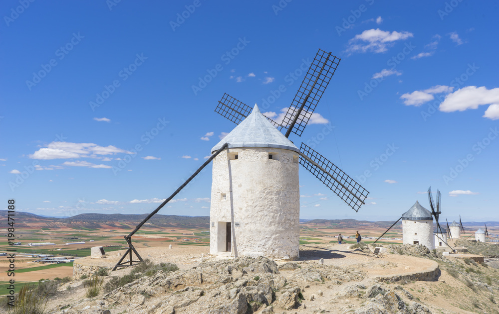 Beautiful summer above the windmills on the field in Spain
