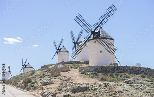 Tourism, Beautiful summer above the windmills on the field in Spain