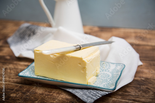 A piece of square natural milk butter 
