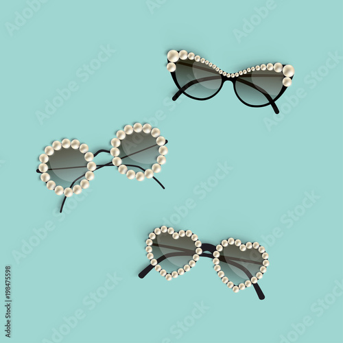 Set of realistic posh sunglasses of different shape decorated with pearls over turquoise background. Vector illustration