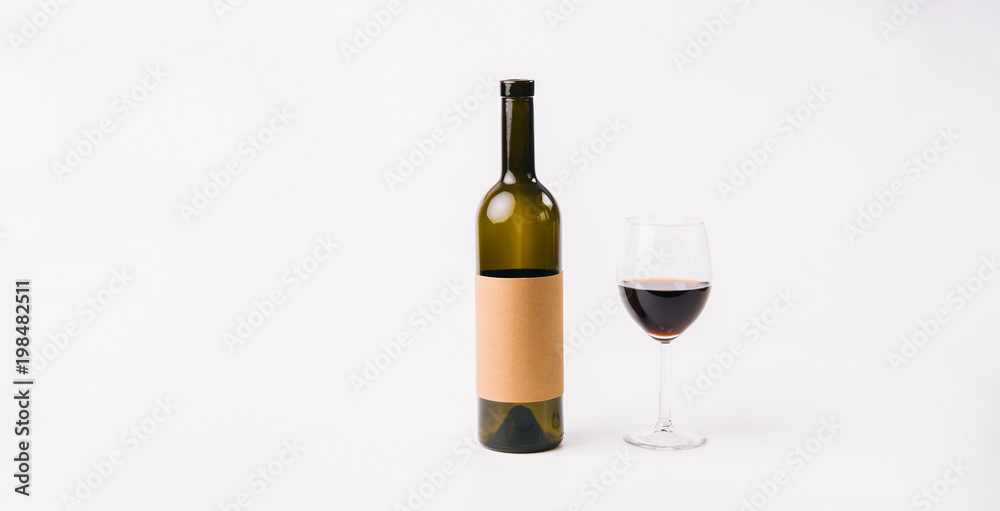 Wine bottle mock-up and glass of red wine Wine bottle mock-up and glass of red wine
