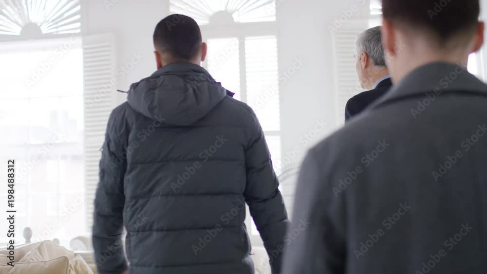 Young male couple viewing a property together, in slow motion Young male couple viewing a property together, in slow motion