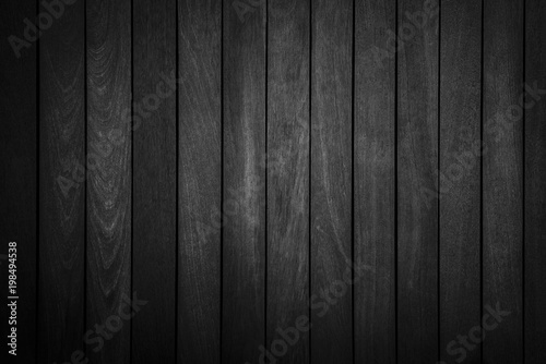 Abstract background from black wood pattern on wall in dark tone. © tawanlubfah