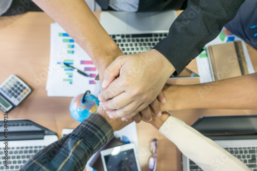 Business teamwork. Business man coworkers with joined hands together. Team work people.