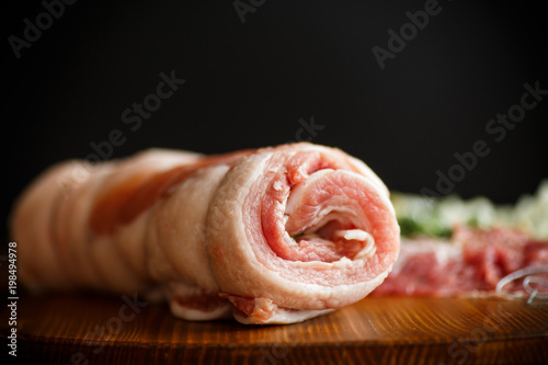 Roll of meat with various spices and herbs