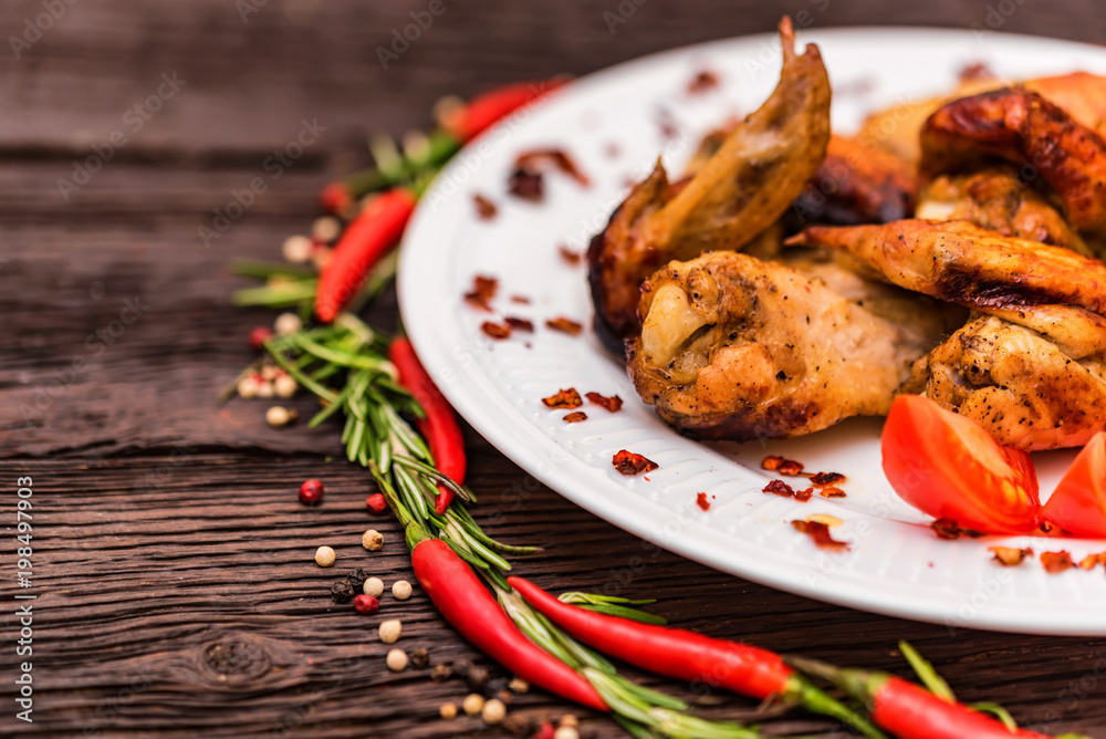 Chicken wings grilled with spices and chili pepper