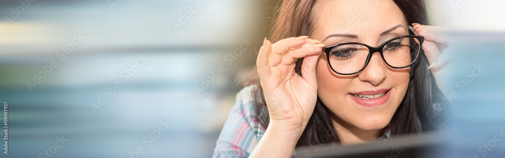 Young woman testing new glasses Young woman testing new glasses