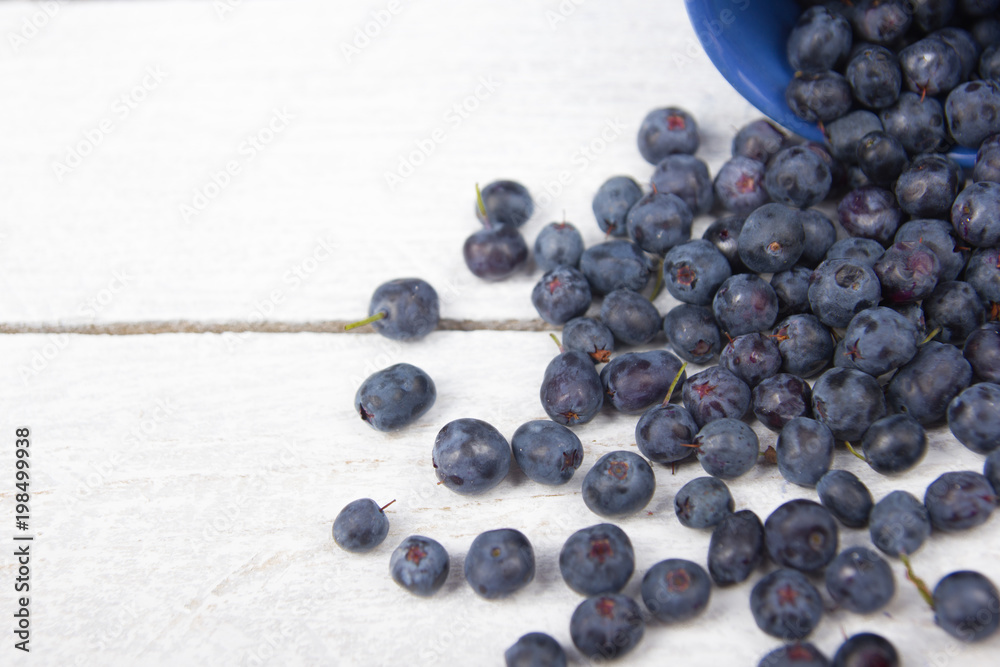 Blueberry on wooden table background, bowl of blueberries. .Antioxidants, detox diet, organic fruits. Berries