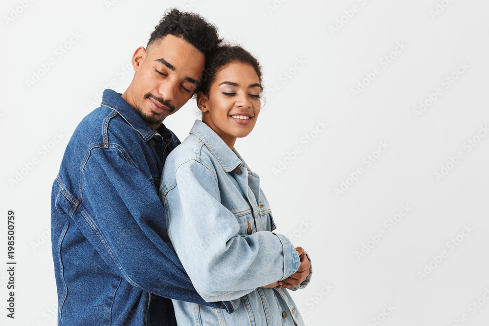 Portrait of a smiling young african couple hugging Portrait of a smiling young african couple hugging