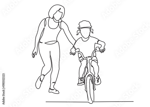 mom teaches her daughter to ride a bike