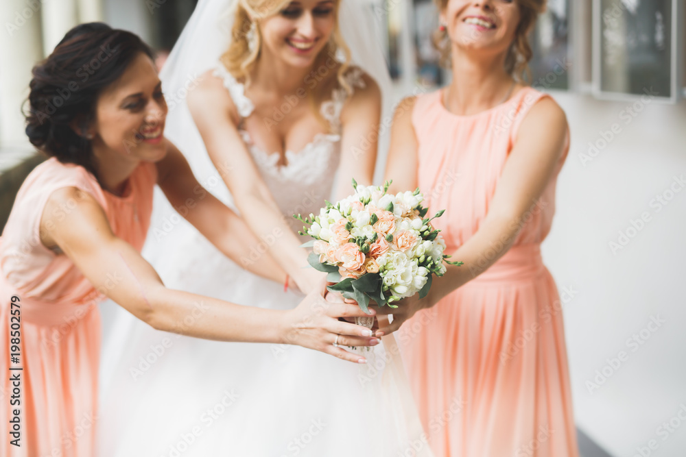 Bride holding big and beautiful wedding bouquet with flowers Bride holding big and beautiful wedding bouquet with flowers