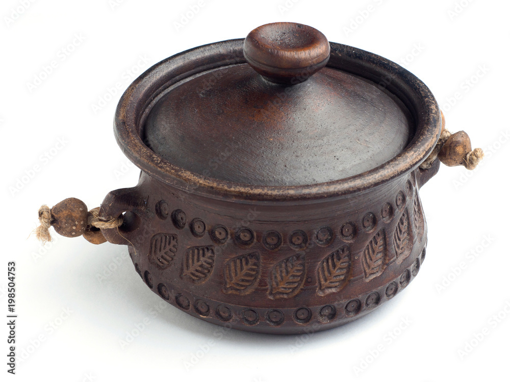 Traditional brown clay pot on isolated white background Traditional brown clay pot on isolated white background