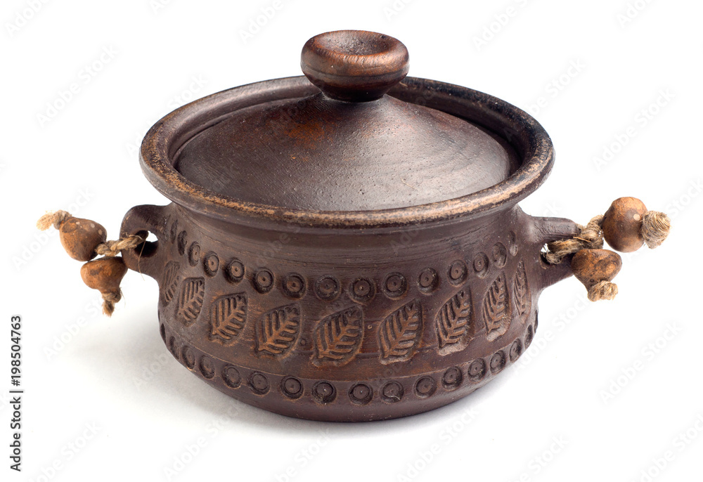 Traditional brown clay pot on isolated white background Traditional brown clay pot on isolated white background