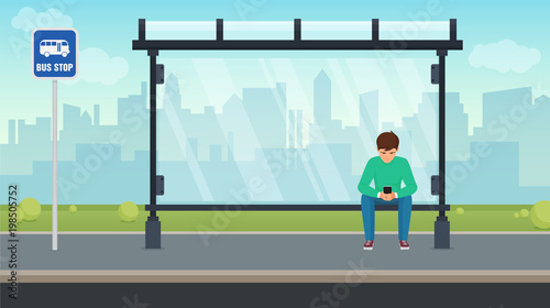 Young man sitting alone at the bus stop and using his phone. Vector illustration.