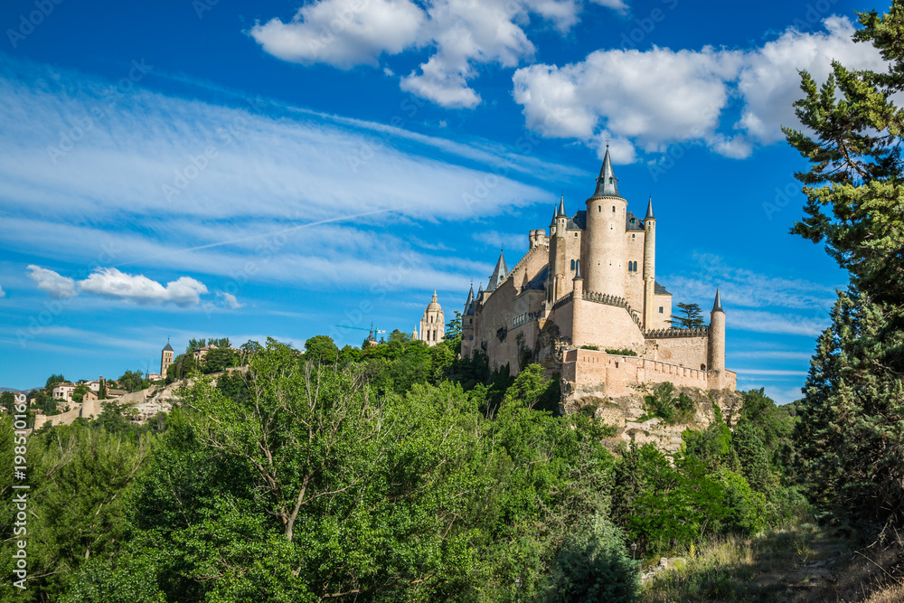 Segovia, Spain. The famous Alcazar of Segovia, rising out on a rocky crag, built in 1120. Castilla y Leon. Segovia, Spain. The famous Alcazar of Segovia, rising out on a rocky crag, built in 1120. Castilla y Leon.