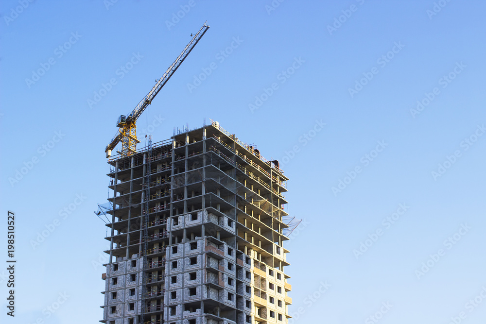 Modern multi-storey building in the city on the shore on blue sky background Modern multi-storey building in the city on the shore on blue sky background