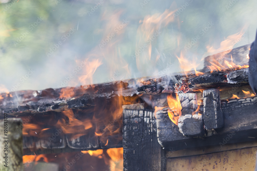 Photo of a fire in an old wooden house