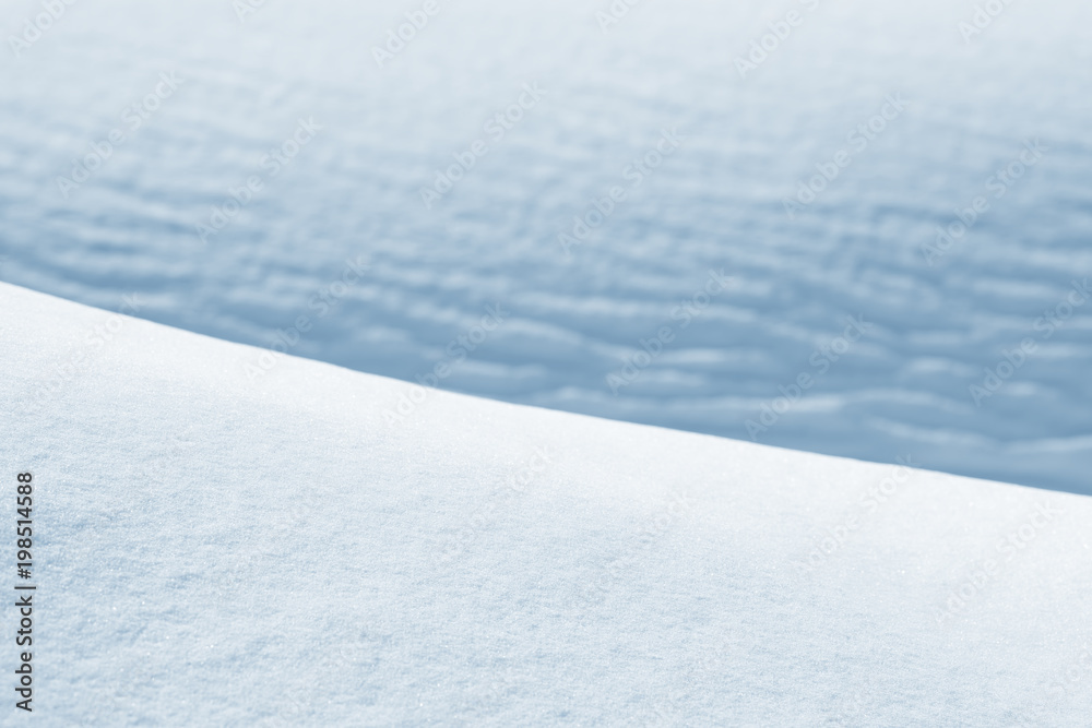Fresh snow background texture. Winter background with snowflakes and snow mounds.