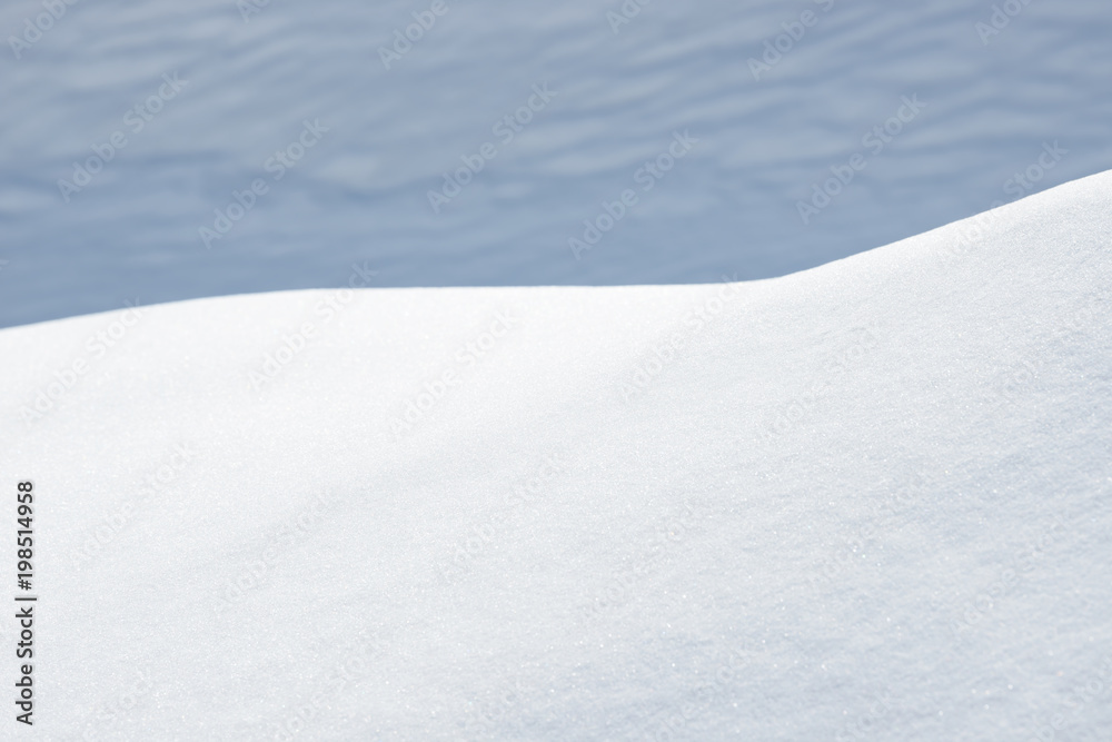 Fresh snow background texture. Winter background with snowflakes and snow mounds.