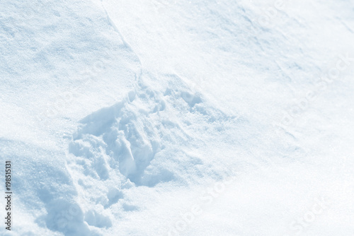 Fresh snow background texture. Winter background with snowflakes and snow mounds.