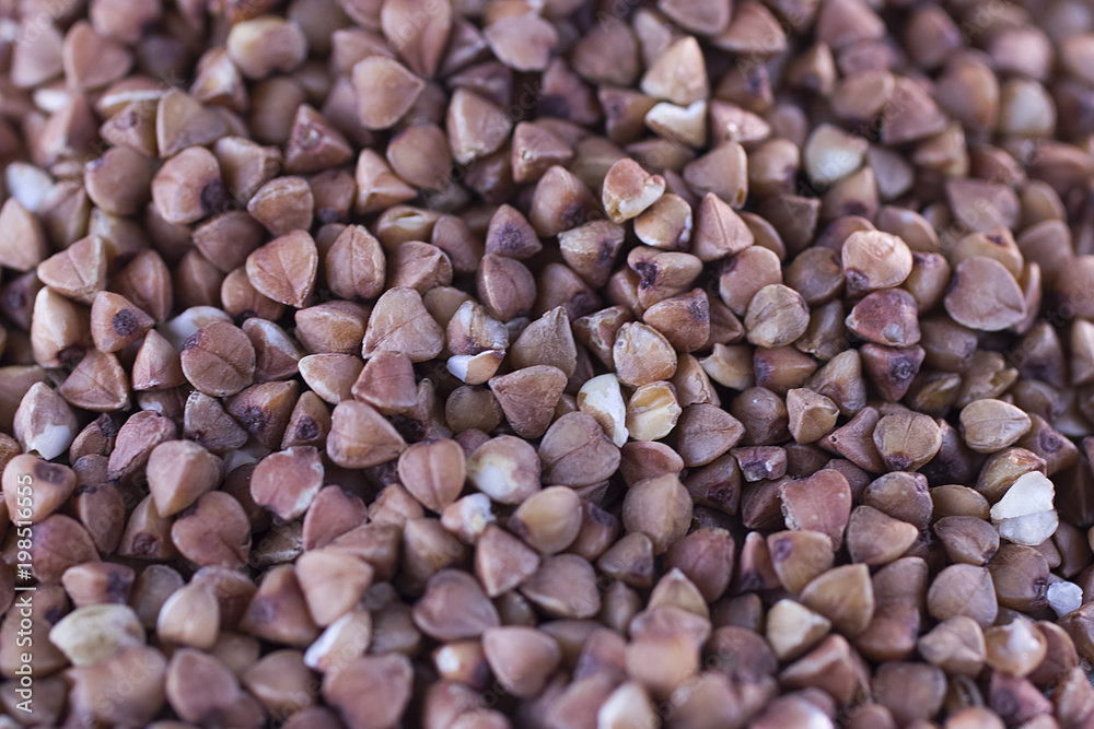 Buckwheat cereal on gray background. Food background. Buckwheat cereal on gray background. Food background.