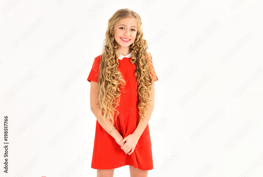 Hair salon, barber, skincare, look. Hairdresser, makeup, shampoo. Beauty, kid fashion, cosmetics, healthy hair. Little girl with curly long hair and makeup. Happy girl in red dress isolated on white.