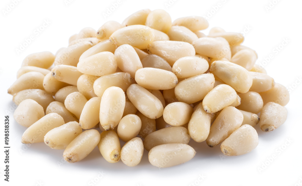 Pine nuts on the white background. Organic food. Pine nuts on the white background. Organic food.