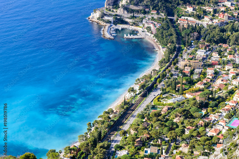 Beautiful aerial view of a beach with blue water, Eze town, Cote d'azur, France