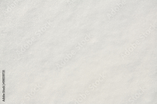 white even sparkling snow. texture uniform background. top view