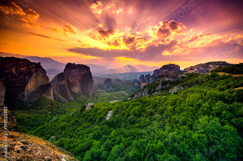 Breathtaking view of Meteora at sunset, Greece. Geological formations of big rocks with Monasteries on top of them.