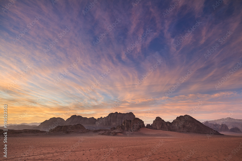 beautiful pink sunset above desert in Jordan beautiful pink sunset above desert in Jordan