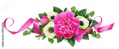 Pink peonies and anemone flowers in floral arrangement