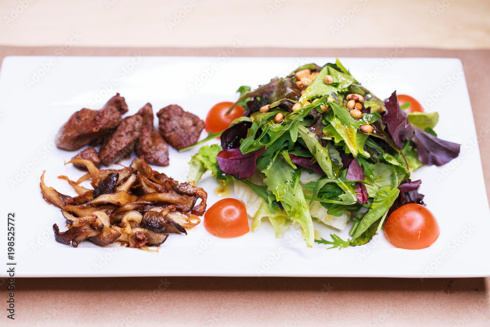 Salad with arugula and fried mushrooms and with liver Salad with arugula and fried mushrooms and with liver