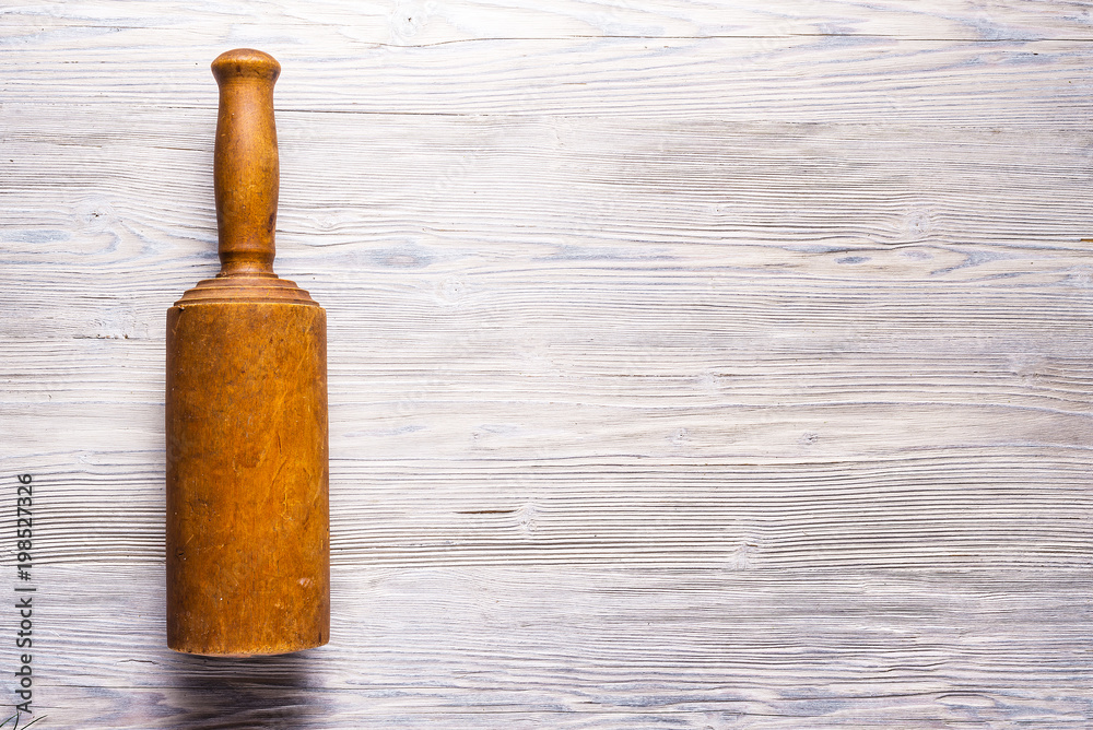 Antique wooden tool on background