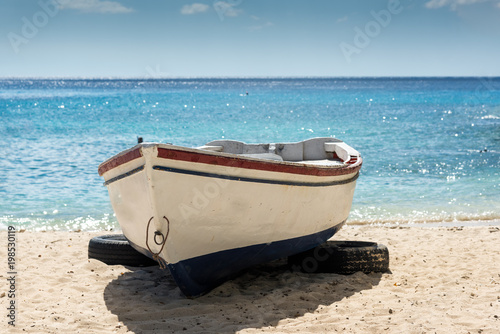 Old fishing boat on sandy beach