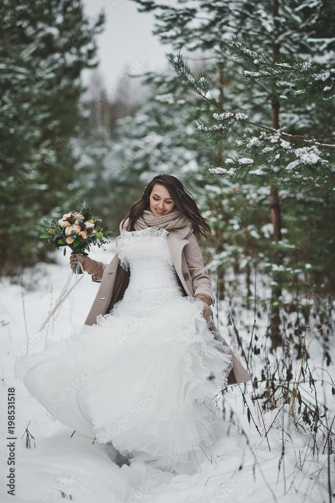The bride against the winter snow-covered forest of firs and pines 853. The bride against the winter snow-covered forest of firs and pines 853.