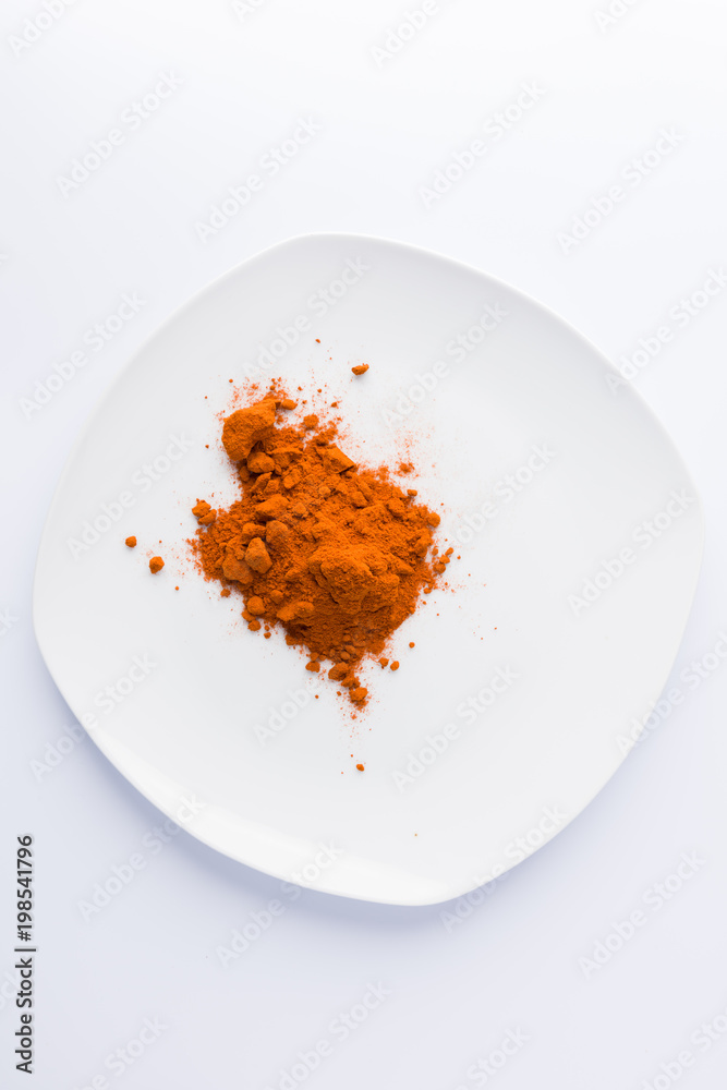paprika on plate on white background paprika on plate on white background