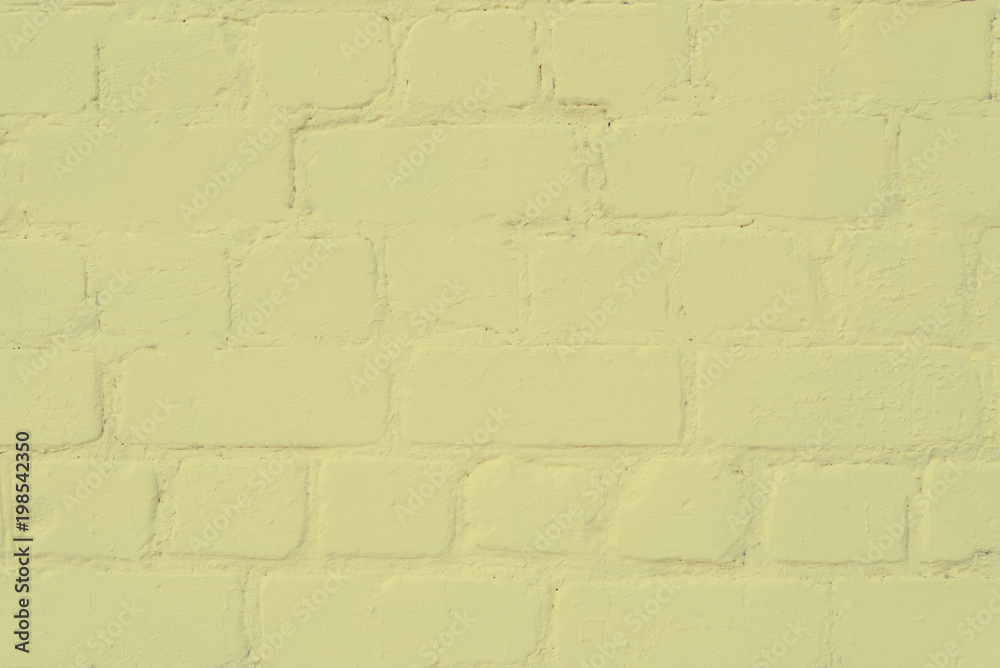 the surface of the brickwork is painted with yellow paint