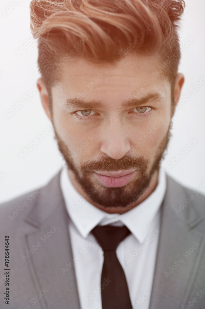 Serious businessman wearing suit and tie. blue background Serious businessman wearing suit and tie. blue background